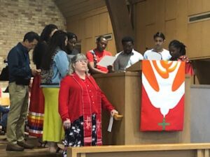 photo showing photo of various speakers during pentecost service